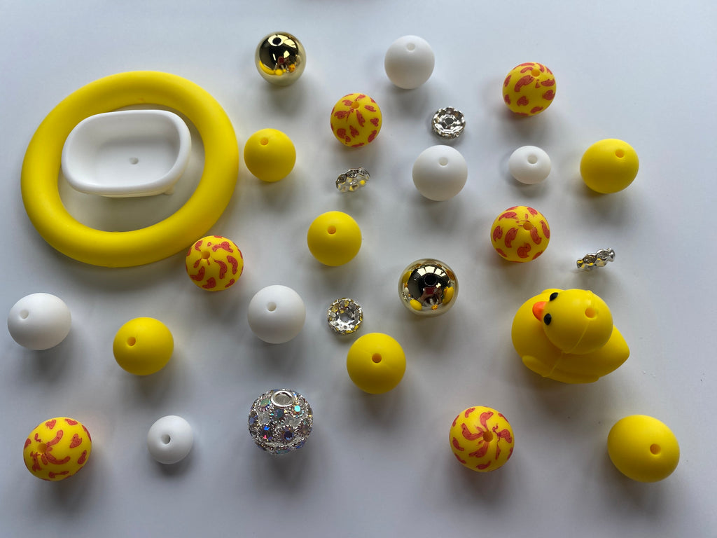 Focal*2, Silicone ring*1, Silicone beads 15mm*16pcs, Printed beads 15mm*8pcs, Fancy beads 15mm*5pcs, Spacers 10mm*12pcs, Lentils 12mm*12pcs. Used to make bracelets, lanyards, necklaces, key chains, pens, school bag pendants, friendship gifts and other crafts